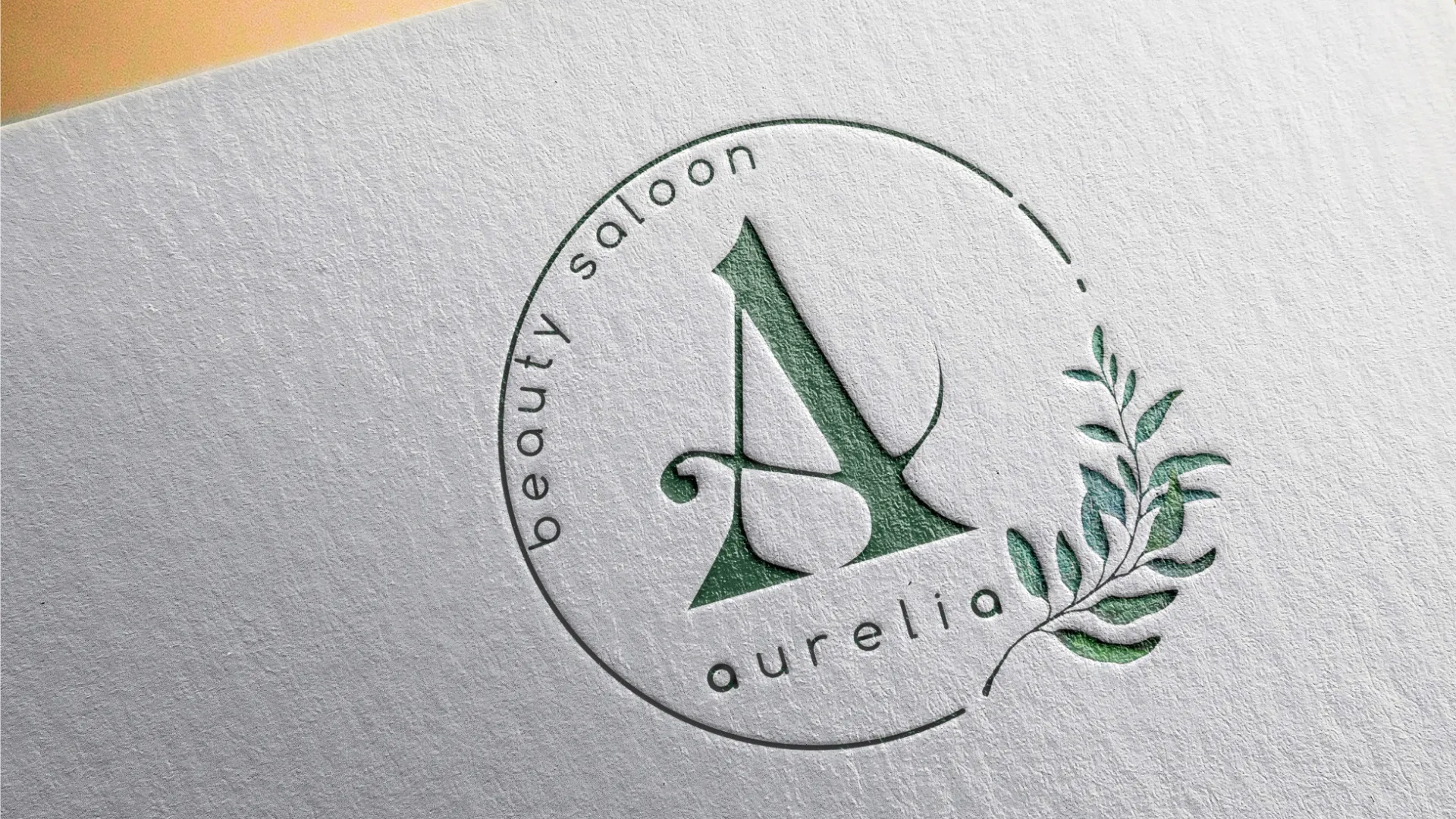 Логотип салона красоты Aurelia на визитке